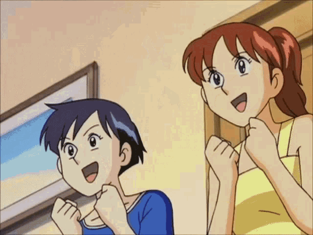 a boy and a girl are standing next to each other in a room