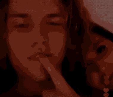 a close up of a person 's face with a blurred background