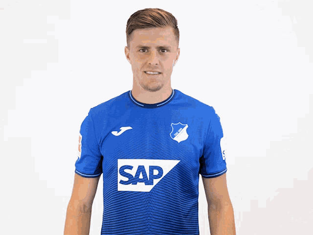 a man wearing a blue shirt with the word sap on it