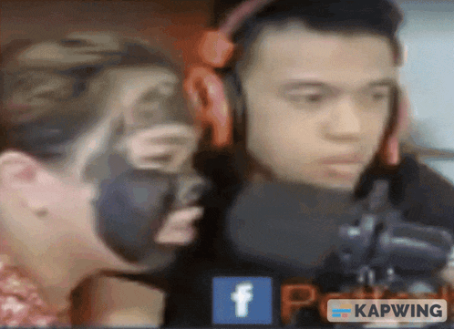 a man wearing headphones and a woman wearing a black mask are shown on a screen with a facebook logo in the corner