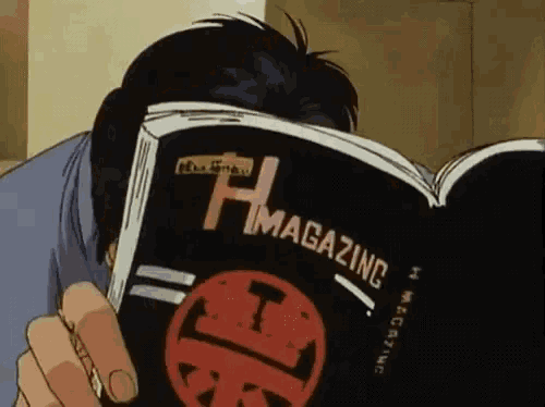 a man is reading a magazine that says h magazine