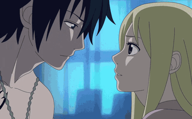 a man and a woman are looking at each other with a blue background
