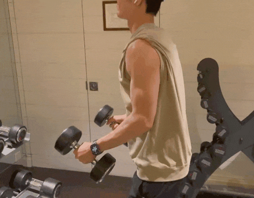 a man wearing a hat is lifting a dumbbell with a circle around it