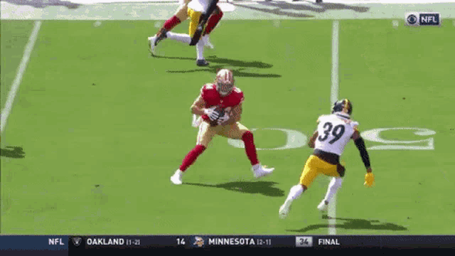 a football player with the number 44 on his jersey is being tackled