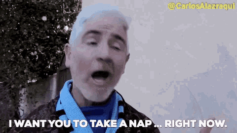 a man with gray hair and a scarf around his neck says " i want you to take a nap right now "
