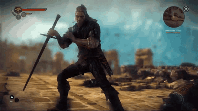 a video game screen shows a man holding a sword and says legend the attack on the bottom