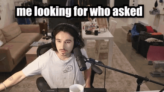 a man wearing headphones sits in front of a microphone with the words me looking for who asked above him