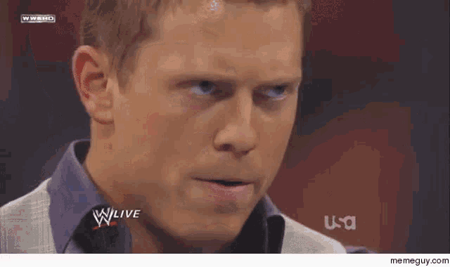 a close up of a man 's face with the words w live on the bottom right