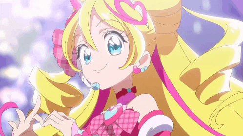 a girl with blonde hair and blue eyes is wearing a pink dress