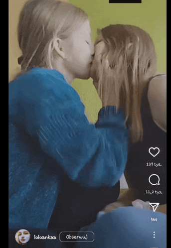 a screen shot of two girls kissing with the name loloankaa at the top