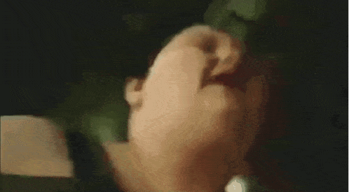 a blurry picture of a person 's face with their mouth open