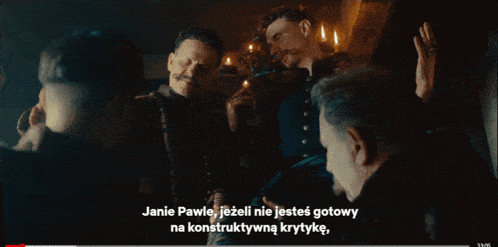 a group of men are sitting around a table and one of them says " ale twoj kuzyn stosuje "