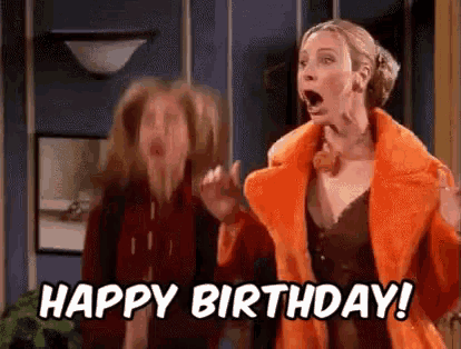 two women are standing next to each other and one of them is wearing an orange fur coat .