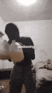 a man wearing boxing gloves with the word pissboxing on the bottom right