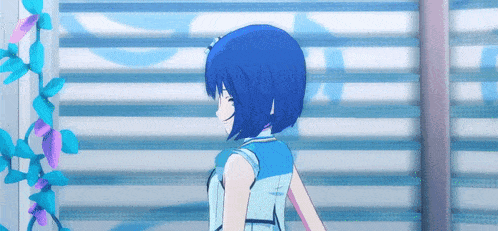 a blue haired anime girl is standing in front of a white wall