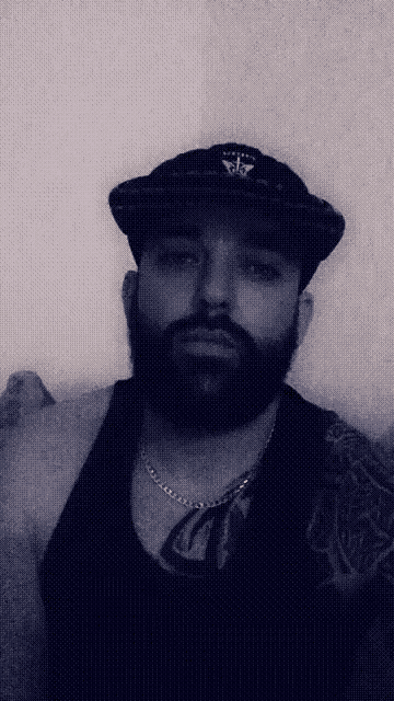 a man with a beard is wearing a hat that says ' abercrombie & fitch ' on it