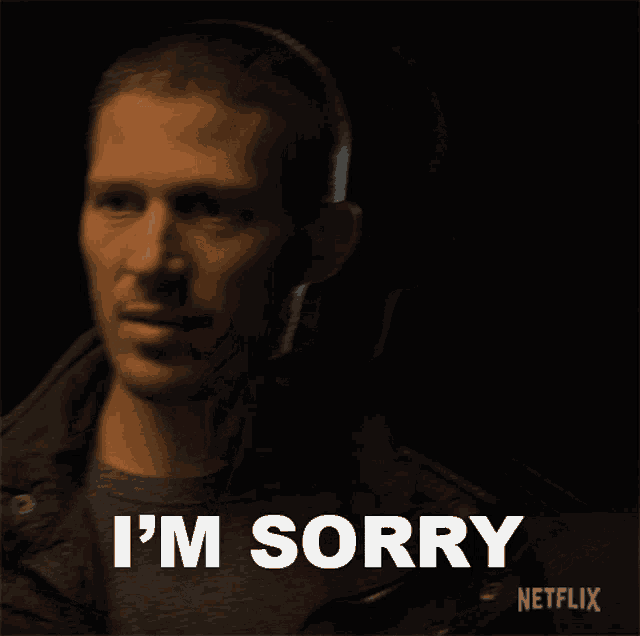 a man says i 'm sorry in a dark room