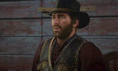 a man with a beard is wearing a cowboy hat