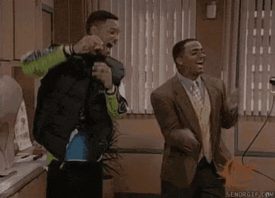 a couple of men are standing next to each other in a room .