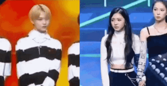 a man and a woman are standing next to each other on a stage and holding hands .