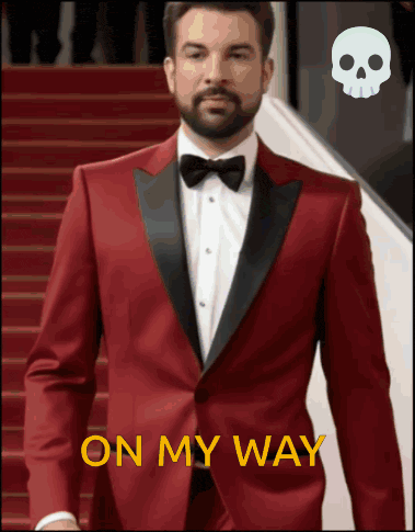 a man in a red tuxedo is walking down stairs with the words on my way above him
