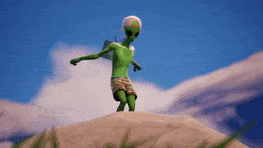 a green alien standing on top of a hill