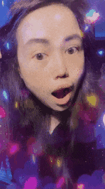a woman with a surprised look on her face is surrounded by a colorful background