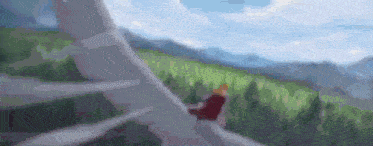 a blurry picture of a person riding a bike on a road in the mountains .