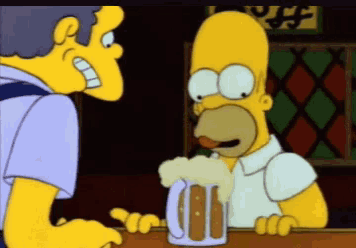 a cartoon of homer simpson sitting at a bar holding a mug of beer
