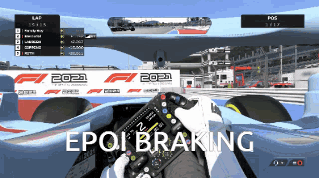 a person holding a steering wheel in front of a race car that says 2021