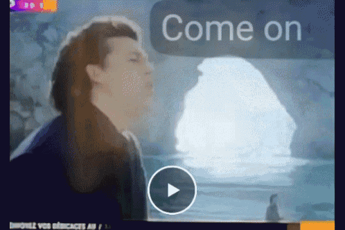 a man is standing in front of a cave and the words come on are on the screen
