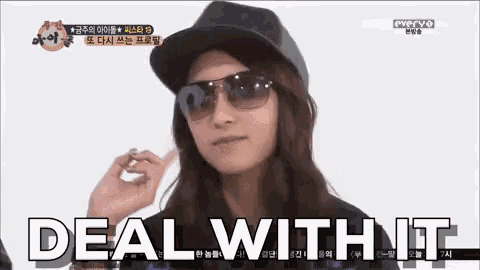 a woman wearing sunglasses and a hat with the words deal with it behind her
