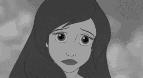 a black and white photo of a cartoon girl with long hair looking sad .