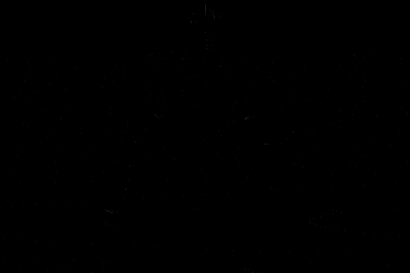 a silhouette of a person standing in front of a wall with hieroglyphs