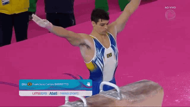 a gymnast with the number 71 on his back is doing a trick