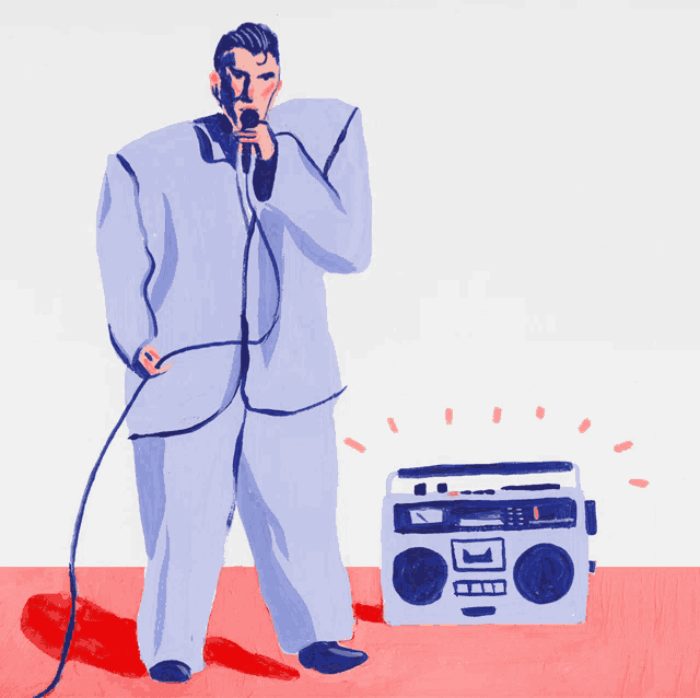 a man is singing into a microphone next to a boombox