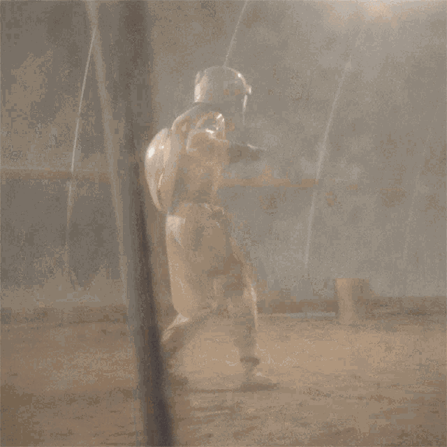 a person in a space suit is standing in a foggy room