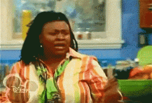a woman in a colorful striped shirt with disney written on it