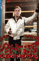 a man in a white jacket is standing in front of a bunch of roses and says good morning