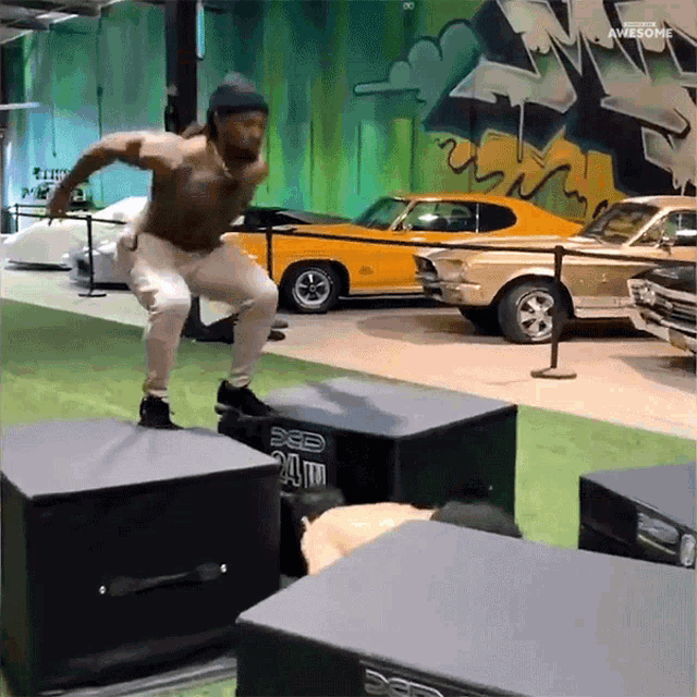a man is jumping over a box that has the word awesome on it