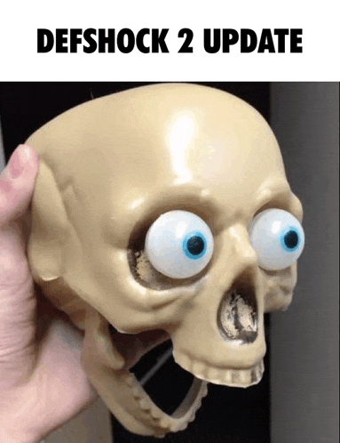 a person is holding a skull with big eyes and the words defshock 2 update above it