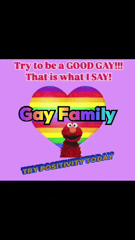 elmo stands in front of a rainbow heart with the words gay family written on it