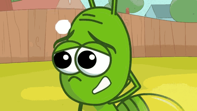 a green cartoon character with a sad look on its face