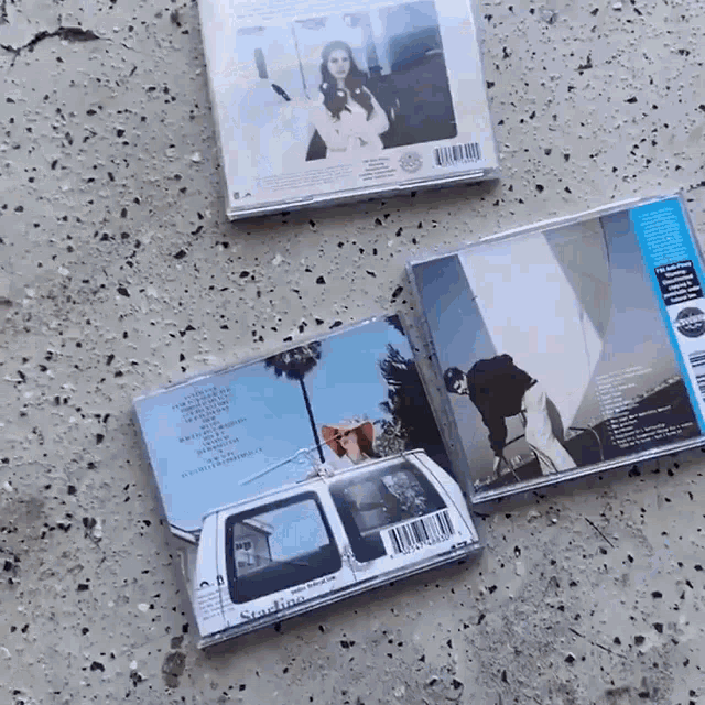 a stack of cd 's with one that says sunshine on the back