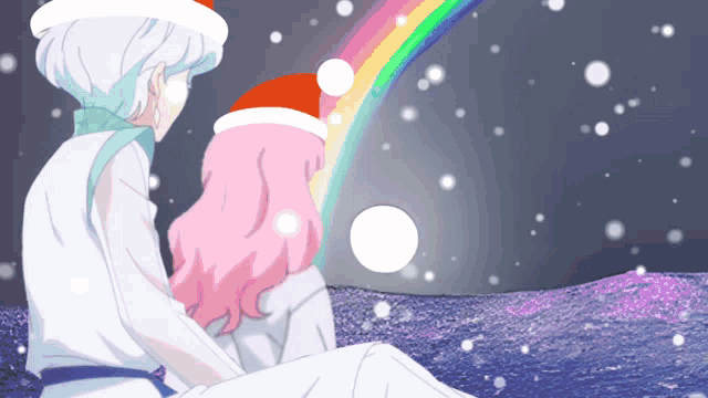 a boy and a girl wearing santa hats looking at a rainbow in the sky