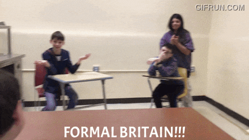 a group of people sitting at desks with the words formal britain on a table