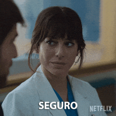 a woman in a lab coat with the word seguro on the bottom right