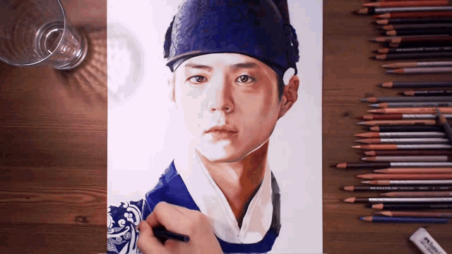 a drawing of a man in a blue hat is surrounded by colored pencils and an eraser