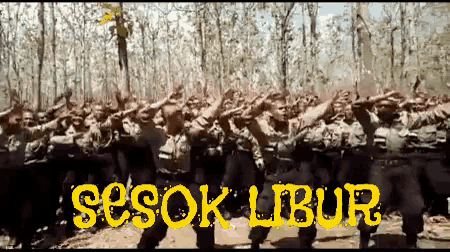 a group of people standing in a forest with the words sesok libur written on the bottom