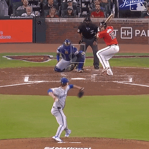 a baseball player with the number 12 on his jersey is swinging at a pitch
